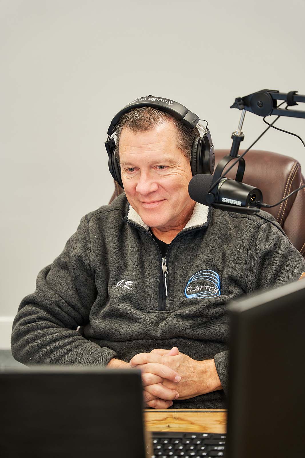 J.R. Flatter at Podcasting Desk