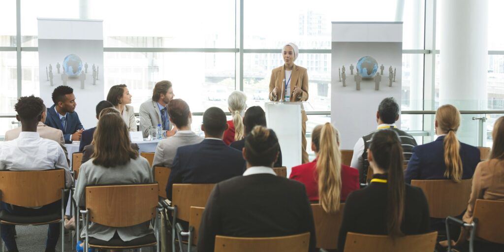 Female speaker speaking in a business seminar in modern office building